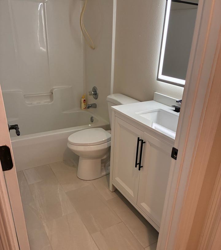 Large-format tile floor and new vanity