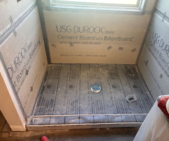 Cement board walls over a 40 mil PVC shower liner