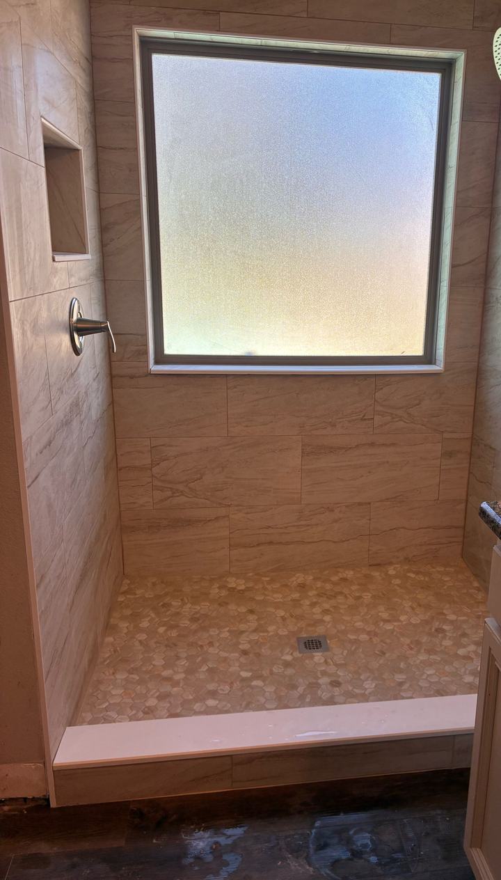Pebble mosaic shower floor