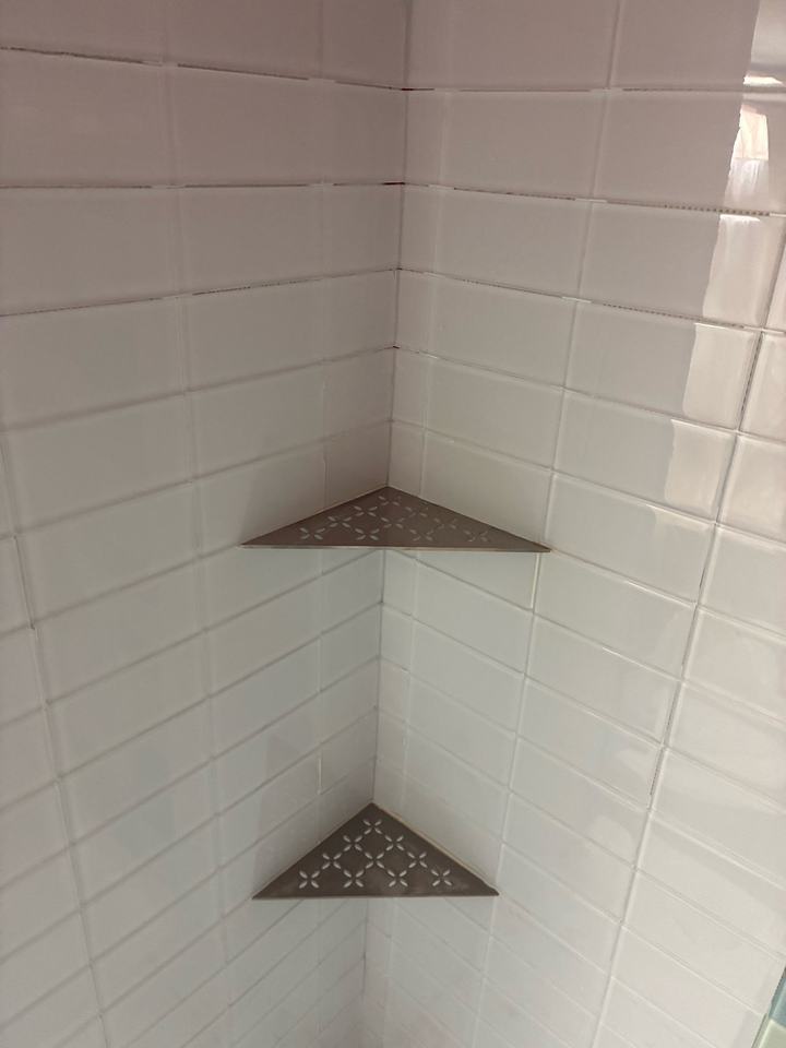 White subway tile with corner shelves